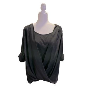 Calvin Klein blouse, adorned with gold zippers, draped in front